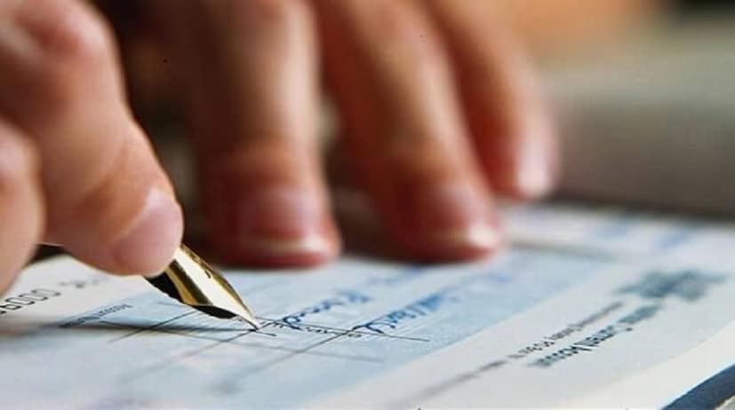One of the most common types of cheques, bearer cheques, carry certain risks. Money can be claimed not only by the person named on the cheque but also by the holder of the cheque. To prevent misuse, banks require a signature on the back for identification and record-keeping. The person presenting the cheque at the bank is expected to sign. (News18 Telugu)